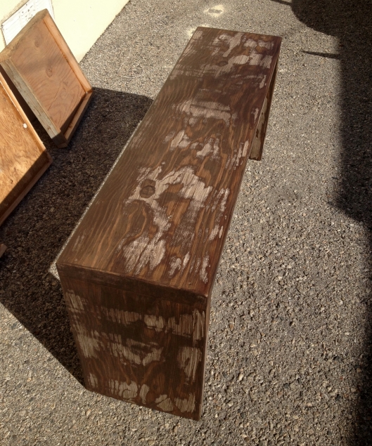 Modern reclaimed wood bench finished with semi-transparent stain